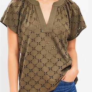 Loft-pretty eyelet at front, flowy soft knit at back, flattering split neck top.